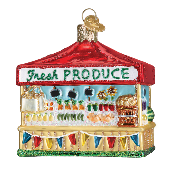 The Farmer's Market Stand 28122 Old World Christmas Ornament is a vibrant glass ornament designed to resemble a farmer's market stall with a red roof. It features the label "Fresh Produce" and displays an array of farm-to-table fruits and vegetables, all embellished with a decorative garland and gold accents.