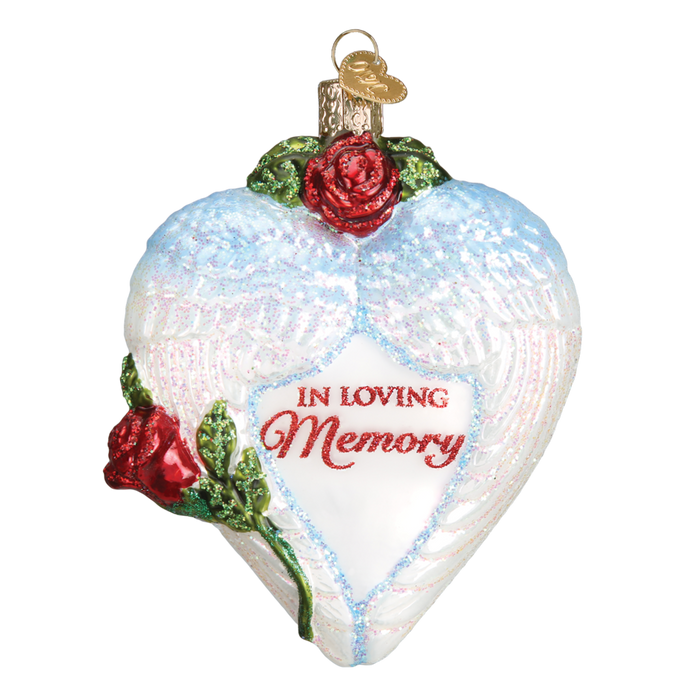 The In Loving Memory 30050 Old World Christmas Ornament is a heart-shaped angel with white wings, red roses, “In Loving Memory” in red script, and a gold hanging loop—perfect for cherishing loved ones during the holidays.