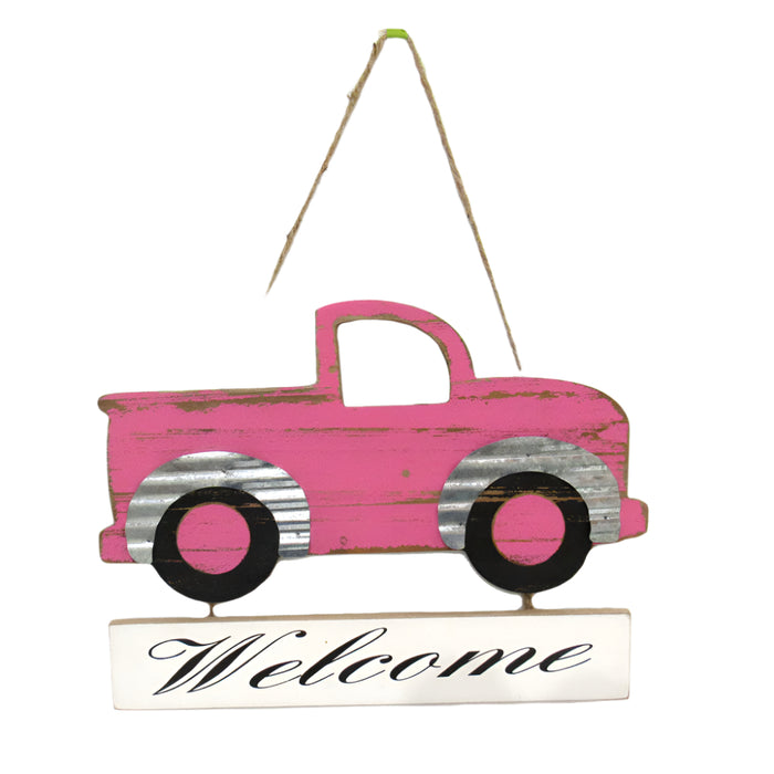 The Pink Truck Welcome Sign 62465PK, crafted from MDF with metal trim and a Welcome plaque, features black wheels and adds warmth to any space, inviting guests in style.