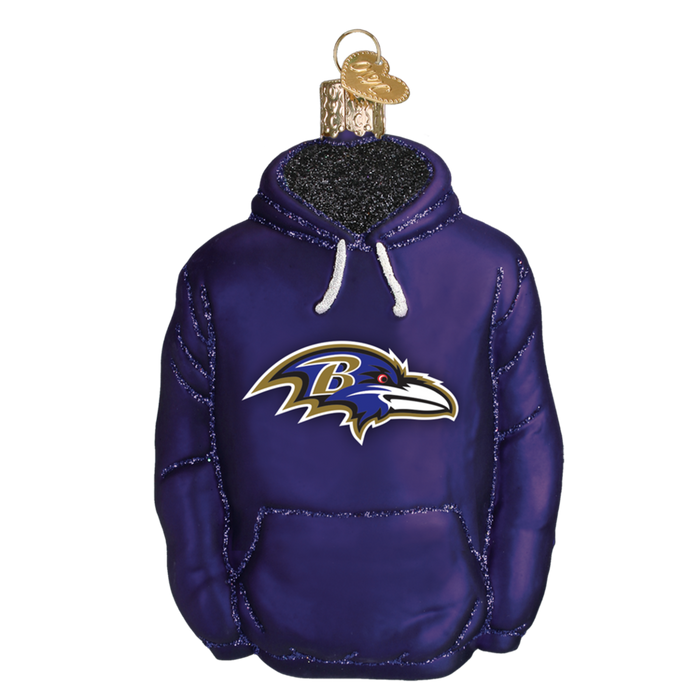 The Baltimore Ravens Hoodie 70303 Old World Christmas Ornament is shaped like a purple hoodie with the team’s logo on the front, featuring a gold loop and cap at the top for easy hanging.