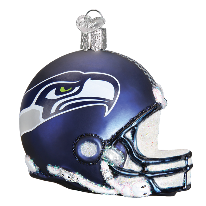 The Seattle Seahawks Helmet 72917 Old World Christmas Ornament is a hand-painted glass football helmet featuring team colors, logo, glitter accents, and a silver hanging loop.