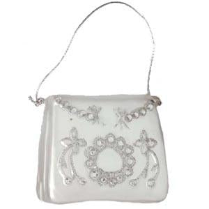 The Party Purse Christmas Ornament from Santa Klaus and Co. is a small, elegant white handbag adorned with silver embroidery and beadwork forming floral patterns, making it a perfect festive ornament or party accessory.