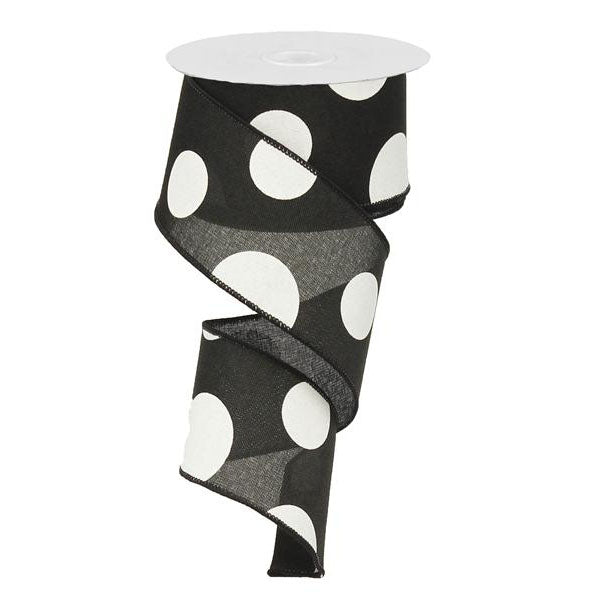 The 2.5 Large Multi Dot Black White Ribbon RX9143X6 features black polyester with large white polka dots, partially unwound and twisted, adding a playful touch to any project.
