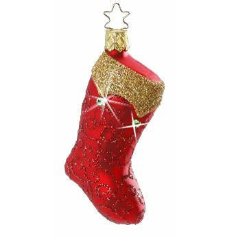 The Making Memories Christmas Stocking Christmas Ornament 1-052-11 by Inge-Glas Germany is a red stocking with a glittery gold cuff, dazzling swirls, Swarovski Elements accents, and a gold star-shaped hook for hanging.