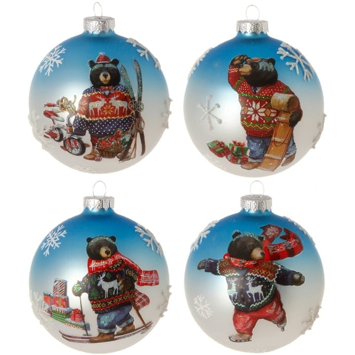 The RAZ 5 Bear in Sweater Ornament Set of 4 features black bears in festive sweaters holding skis, a sled, a scooter with gifts, or presents, each set against blue and white snowy backgrounds—a delightful holiday collection!.