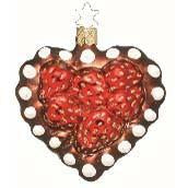 The Strawberry Torte Heart Shaped Christmas Ornament (Inge-Glas of Germany 68106) features red strawberries, white polka dots, and a gold star-shaped hanger. This classic mouth blown glass piece showcases Inge-Glas’ traditional craftsmanship.