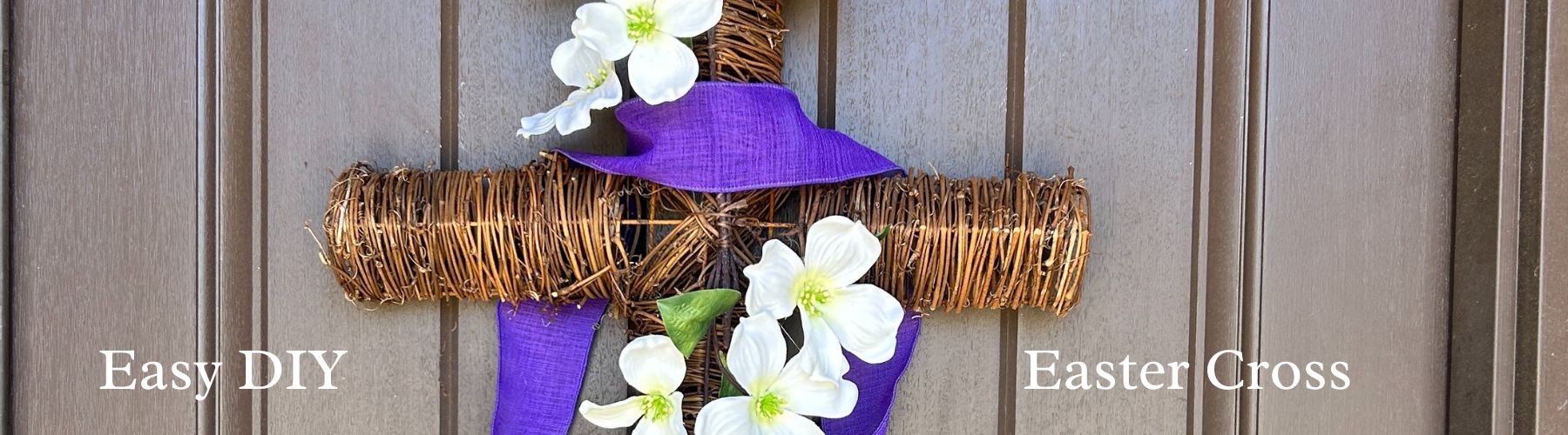 twig cross with dogwood branch and purple ribbon