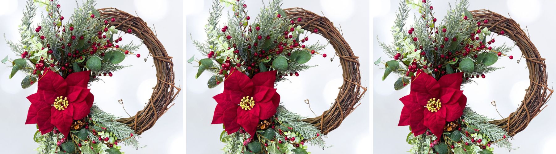 grapevine wreath with winter greenery, red poinsettia and red berries