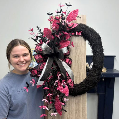 Halloween Wreath on a black vine/moss wreath with hot pink accents