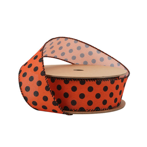 A spool of 1.5" Faux Linen Ribbon (4115W-750-38E) in orange with black polka dots, wired for shaping, is partially unrolled against a white background.