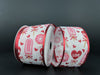Against a dark background, two spools of White Satin/Valentines Day Candy N Donuts ribbon, 2.5x10Y, boast red-edged designs featuring ice pops, donuts, hearts, and the word Love in red and pink hues—perfectly capturing Valentines Day whimsy.