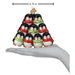 A hand holds a Penguin Family of 9 Old World Christmas Ornament 16156, a pyramid of nine penguins wearing red and green scarves, measuring 4.75 inches wide.