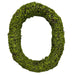 The image features the 18 x 15 Inch Oval Green Moss Wreath (Natural Moss Wreath – 13655GN), shaped with lush green moss for a textured, natural look—a unique décor piece perfect for seasonal displays against a white background.