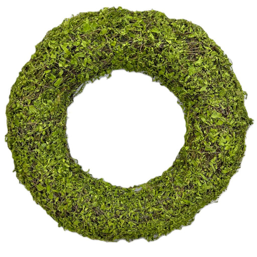 The 18 Inch Green Moss Wreath (13654WR18) features lush leaves and foliage on a sturdy wire, vine, and moss base with a hollow center, displayed against a white background—perfect for wreath making.