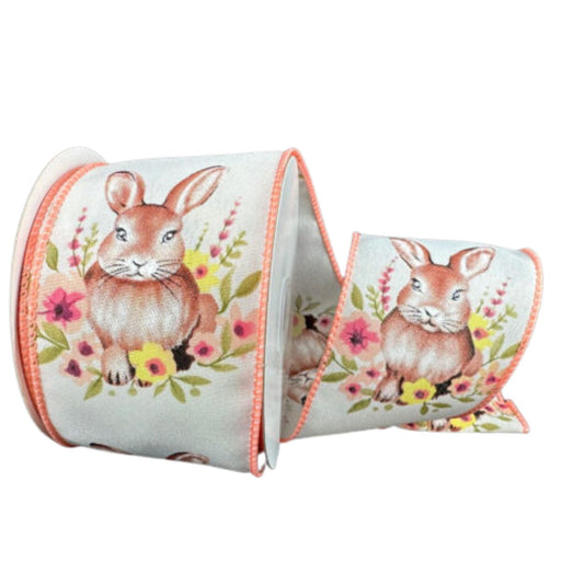 Roll of 2.5" ivory satin ribbon with watercolor bunny and peach floral design, wired peach stitched edges. 32620-40-46
