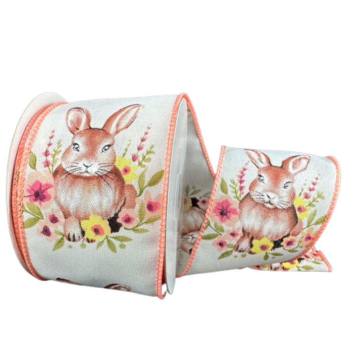 Roll of 2.5" ivory satin ribbon with watercolor bunny and peach floral design, wired peach stitched edges. 32620-40-46