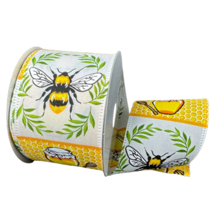 The 2.5 Inch White Satin with Bees and Honey Pots Ribbon (46513-40-01) features bees, honey pots, greenery, and honeycombs on a cheerful yellow background.