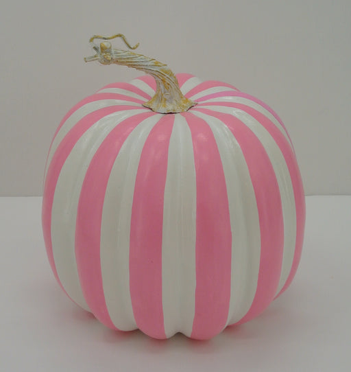 The 7.5 Pink and White Stripe Pumpkin 23066-PKWT, featuring alternating pink and white vertical stripes and a light brown stem, is displayed on a plain white background.