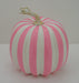 The 7.5 Pink and White Stripe Pumpkin 23066-PKWT, featuring alternating pink and white vertical stripes and a light brown stem, is displayed on a plain white background.