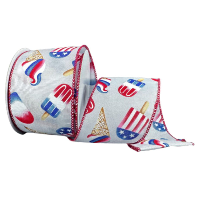 2.5" wide ribbon featuring red, white, and blue ice cream cones and popsicles on a light gray background, wired red stitched edges, partially unrolled from spool.