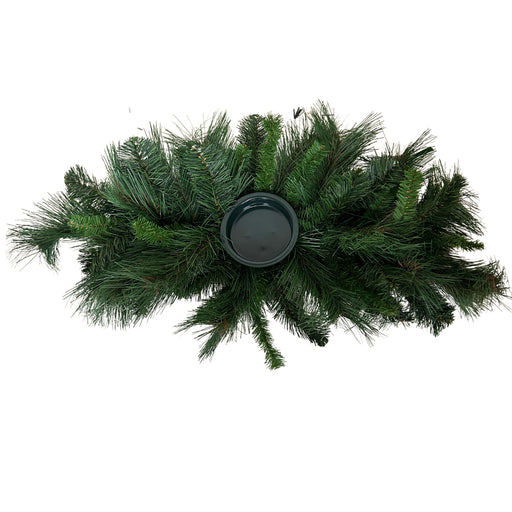 Overhead view of 26-inch mixed pine centerpiece showing full green pine branches and a round candle holder in the center, XG781295-063.