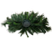 Overhead view of 26-inch mixed pine centerpiece showing full green pine branches and a round candle holder in the center, XG781295-063.