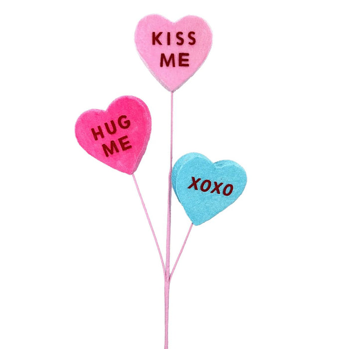 Three-stem conversation hearts spray with pink and blue hearts reading “KISS ME,” “HUG ME,” and “XOXO,” 28 inches tall
