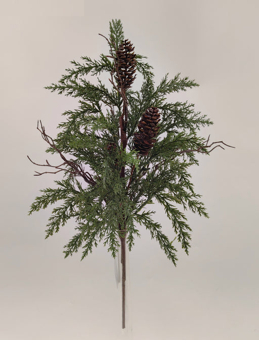 The 22 Green Pine and Cone Bush 32131 showcases artificial evergreen needles, small brown pinecones, and slender twigs, arranged upright against a simple light background.