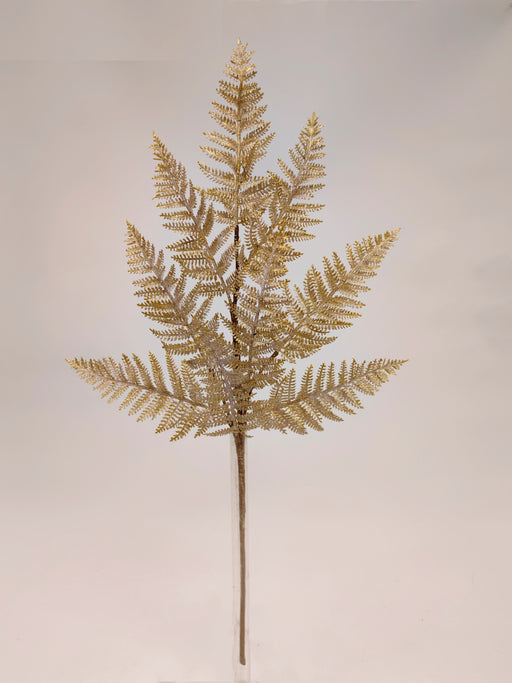 The 29 Gold and White Frosted Fern Spray 32141 features a single gold fern with multiple fronds, accented in white, shown against a simple light background.