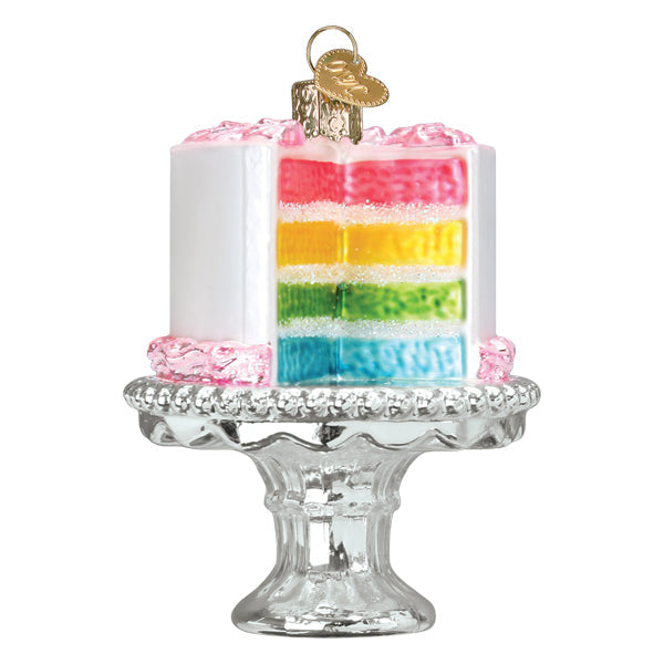 Cake on a Stand Old World Christmas Ornament 32618, a white-frosted glass ornament on a pedestal stand with a sliced, multi-colored rainbow interior.