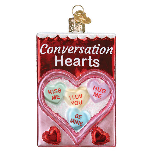 Conversation Hearts Candy Old World Christmas Ornament 32623 shaped like a box of hearts, featuring four candies printed with KISS ME, I LUV YOU, HUG ME, and BE MINE.