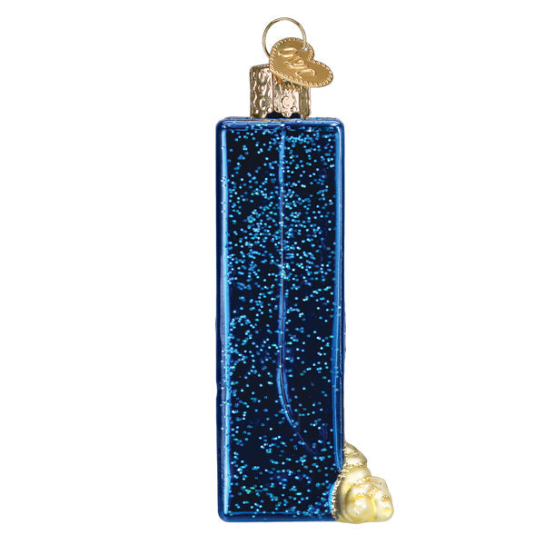 A glittery, rectangular blue Box of Pasta Old World Christmas Ornament 32627 shaped like a pasta box with a small cluster of golden pasta shapes at the bottom.