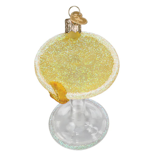 The Lemon Drop Martini Old World Christmas Ornament (32631) is a charming piece shaped like a cocktail glass with a pale yellow drink. It includes a gold cap and a sequined lemon slice, perfect for enhancing any festive décor.