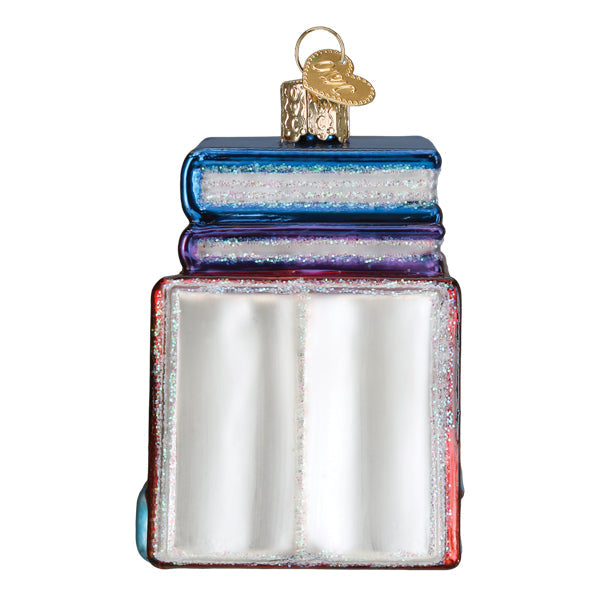 Glass Book Club Old World Christmas Ornament 32653 shaped like a stack of three books with a gold heart-shaped hanger.