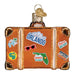 Orange glass Orlando Suitcase Old World Christmas Ornament 32660 decorated with travel-themed stickers, including a map of Florida and sunglasses.