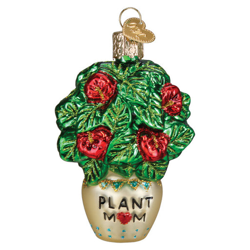 Plant Mom Old World Christmas Ornament 36341, a glass ornament of a potted plant with green leaves, red flowers, and the text PLANT MOM written on the cream-colored pot.