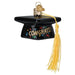 Graduation Cap Old World Christmas Ornament 36342 is a black graduation cap with gold CONGRATS! lettering, colorful confetti accents, and a long yellow tassel.