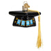 Graduation Cap Old World Christmas Ornament 36342 is a black graduation cap ornament featuring a gold tassel and blue pennants spelling GRAD, ideal as a graduation gift.