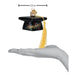 A palm holds a 3.5-inch-wide Graduation Cap Old World Christmas Ornament 36342, featuring a yellow tassel and CONGRATS! written on the front.