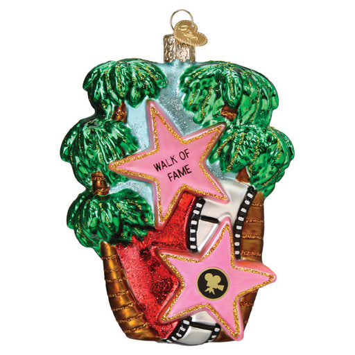 Hollywood Walk of Fame Old World Christmas Ornament 36344 featuring palm trees, a film strip, and two pink stars decorated with a movie camera icon.
