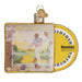 The Goodbye Yellow Brick Road Album Old World Christmas Ornament (38067) exquisitely displays the iconic album cover by Elton John. It includes vivid artwork of a figure stepping onto a yellow brick road, accompanied by a round disc featuring a keyboard design and text. This ornament is an ideal gift for fans of the album.