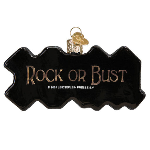 AC/DC Old World Christmas Ornament 38074, a jagged black glass rock and roll ornament featuring the text ROCK OR BUST in gold lettering.