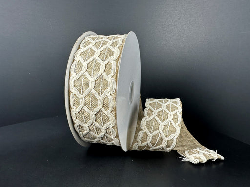 A roll of 1.5X10Y Ivory Burlap Natural Scallop Linen Ribbon 41538-09-15 sits partially unrolled against a dark background, adding elegance and charm to any craft project.