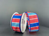 Two spools of 1.5X10Y Red-Royal Blue-Lt Blue-White Wide Stripes Ribbon rest on a gray surface against a matching background.
