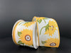 The 2.5X10Y Ivory Linen/Gigantic Sunflowers Ribbon 42441-40-18, set against a dark backdrop, shows off its linen-like texture with large sunflowers and green leaves for a striking display.