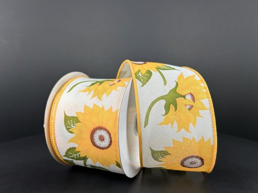 The 2.5X10Y Ivory Linen/Gigantic Sunflowers Ribbon 42441-40-18, set against a dark backdrop, shows off its linen-like texture with large sunflowers and green leaves for a striking display.