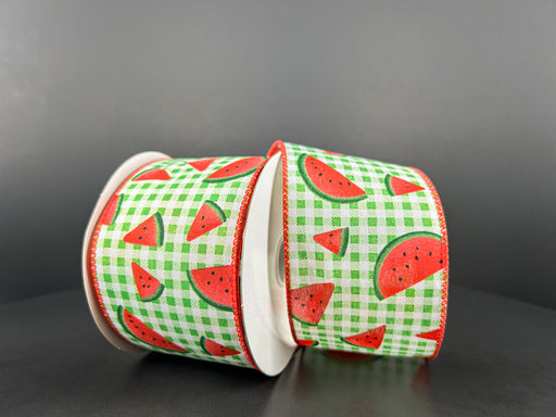 Two rolls of Lime-White Gingham/Watermelon Slices Ribbon, 2.5X10Y 42449-40-43, rest against each other, showcasing red watermelon slices on a lime and white gingham backdrop with red edges and a gray background that enhances the vivid colors.