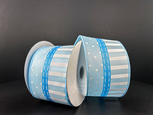 The Lt Blue Satin/Glitter Linen-White Dots N Stripes ribbon, 2.5X10Y (product ID: 42456-40-04), elegantly rests on a dark surface, showcasing its thin woven blue band against a black background.