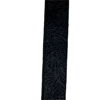 The 1.5 by 10 Yard Black Flower Embossed Ribbon (42466-09-21) stands out beautifully on a plain white background, resembling a delicate ribbon with intricate flower patterns.