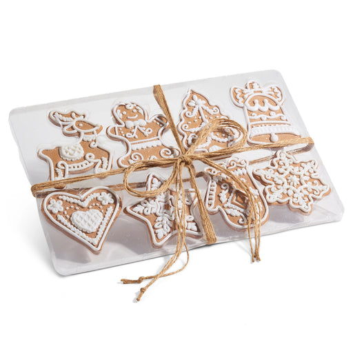 The 4.75" Box of Gingerbread Ornaments 4416141 features festive cookies with white icing, packed in a clear plastic box and tied with rustic brown twine—an ideal addition to your Holiday Collection.